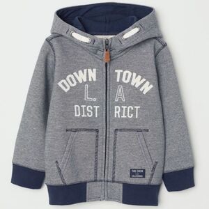 H&M Soft Sweatshirt Jacket With a Motif At Front. Lined hood. zip at front